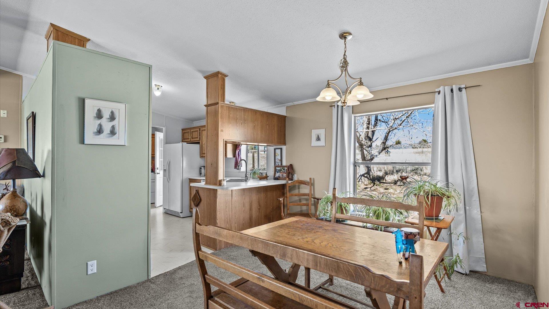 17177 Meadow Drive Cedaredge, CO 81413 - Photo 9 of 30 a dining room with furniture and window