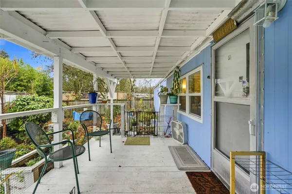 a view of a porch with furniture
