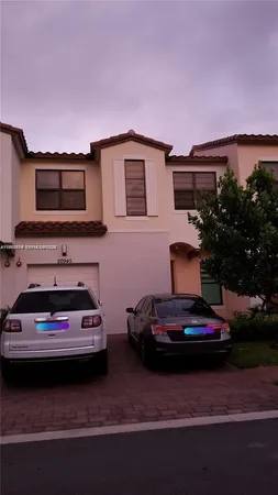 a car parked in front of a house