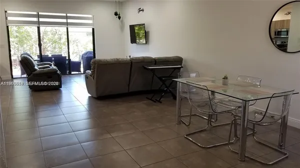 a living room with furniture and a window