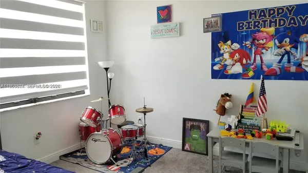 a room with toys and flowers