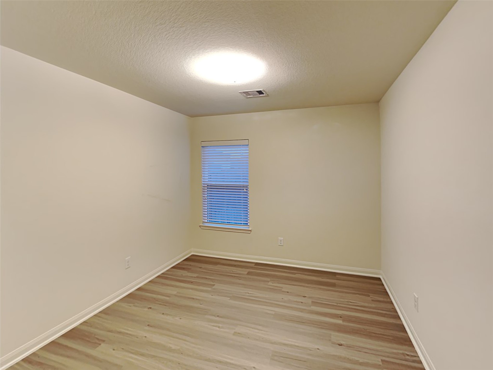 22718 Klingamans Way Hockley, TX 77447 - Photo 15 of 20 a view of an empty room with wooden floor