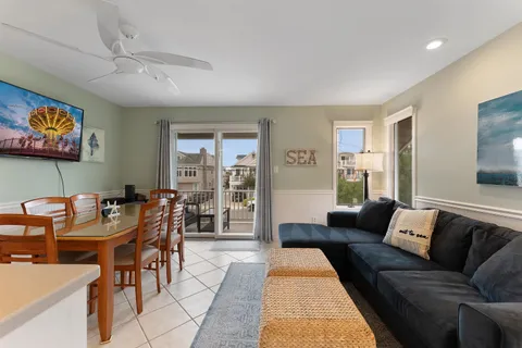 a living room with furniture and a rug