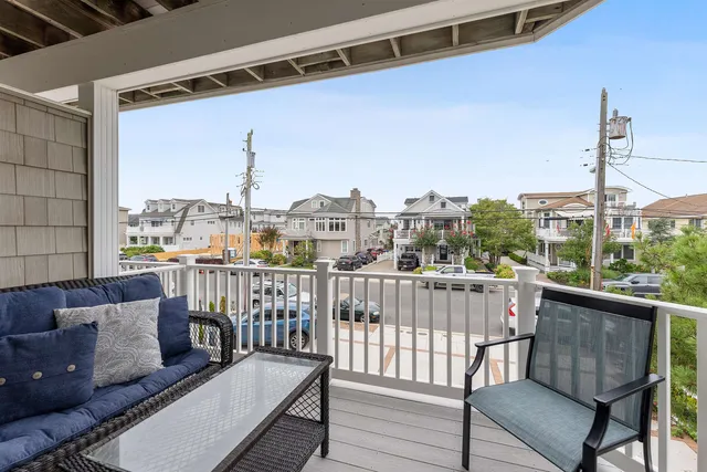 a view of a balcony with furniture