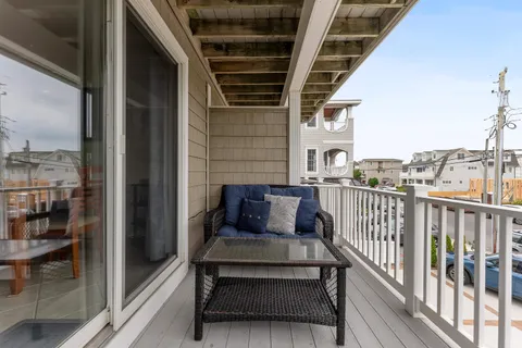 a view of a balcony with furniture