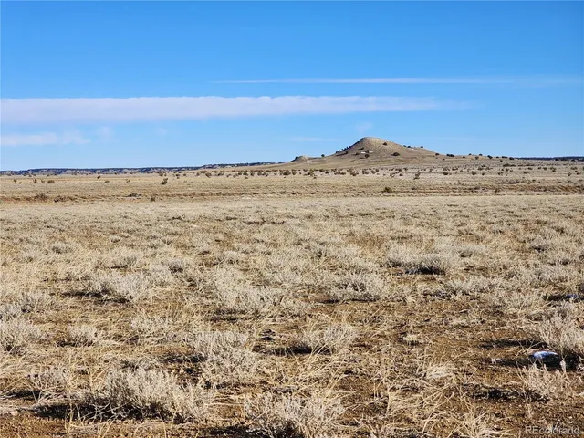 a view of ocean beach and mountain