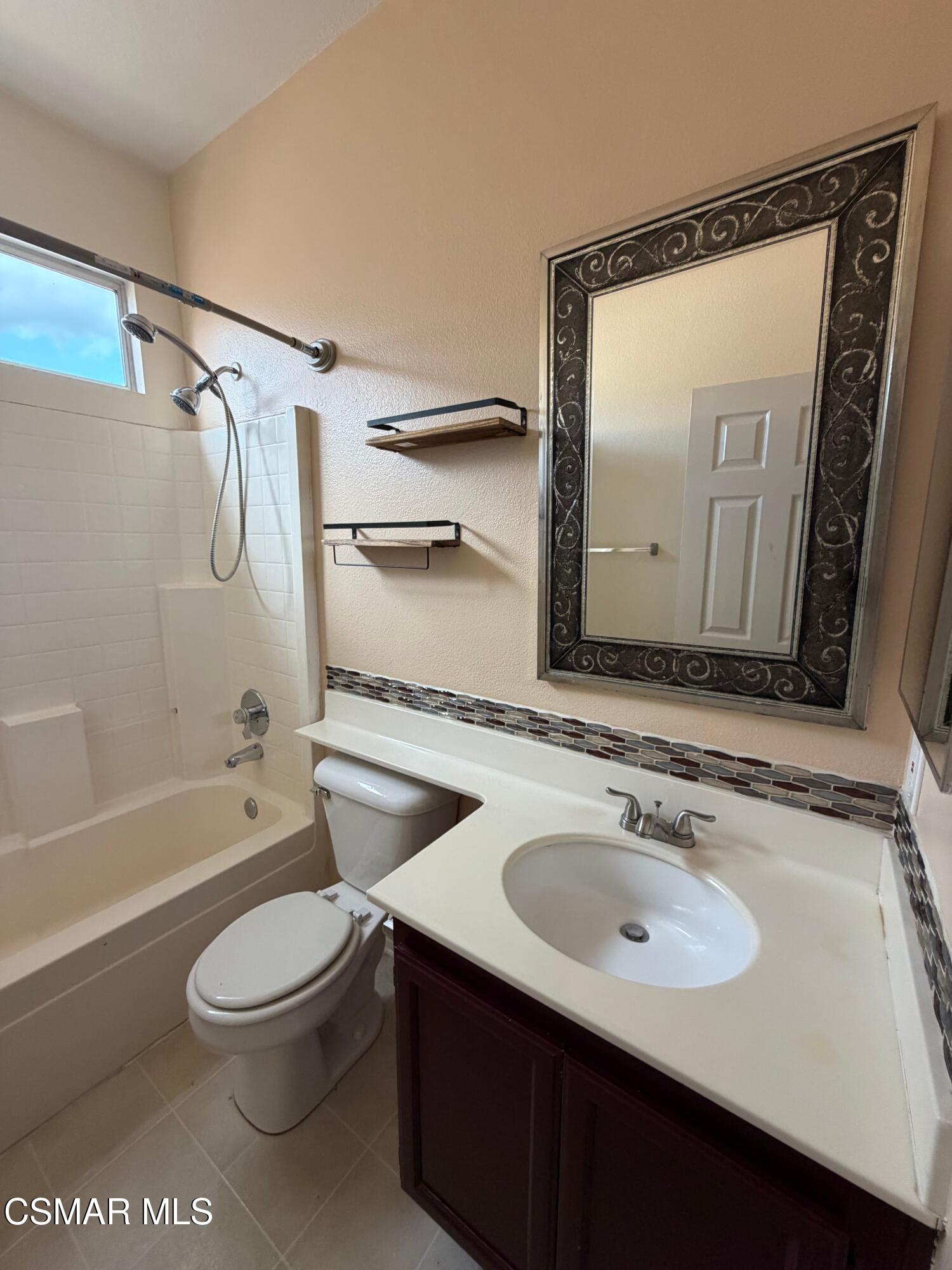 1961 Brookberry Lane Simi Valley, CA 93065 - Photo 17 of 23 a bathroom with a sink a toilet and a mirror