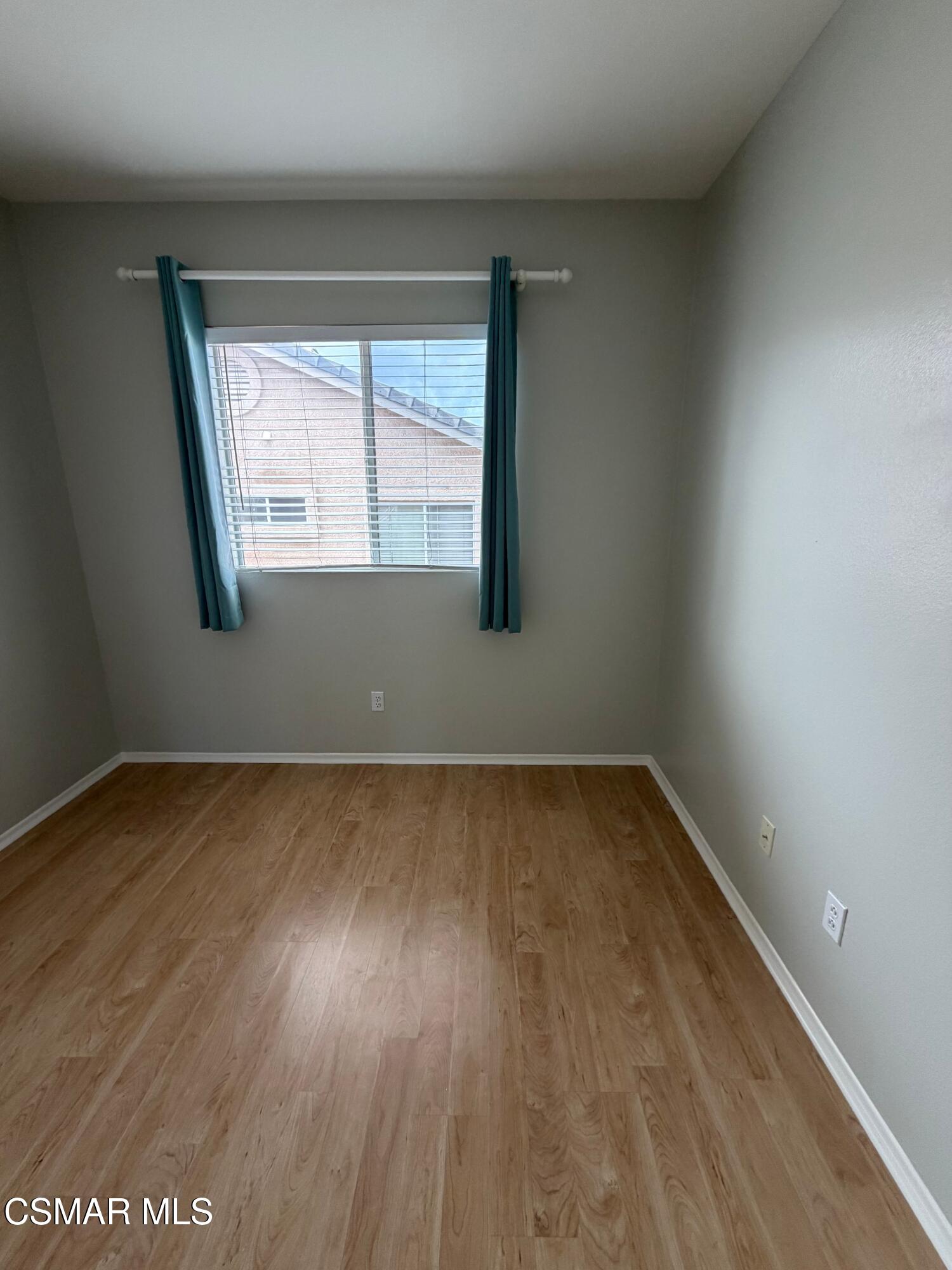 1961 Brookberry Lane Simi Valley, CA 93065 - Photo 18 of 23 wooden floor in an empty room with a window