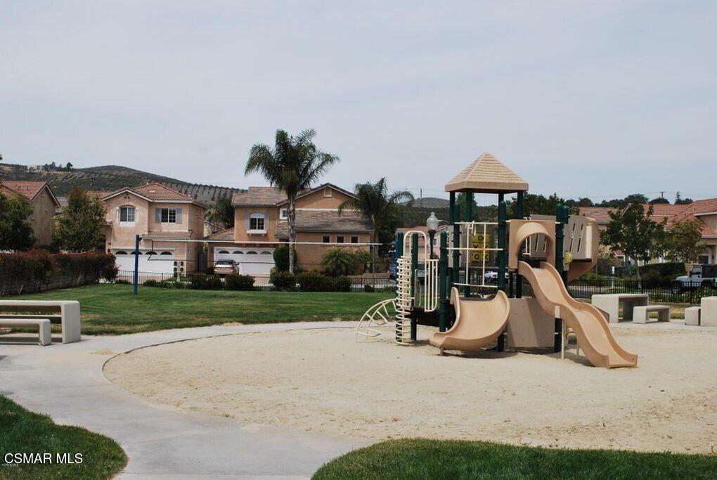1961 Brookberry Lane Simi Valley, CA 93065 - Photo 23 of 23 a view of a house with a yard and sitting area