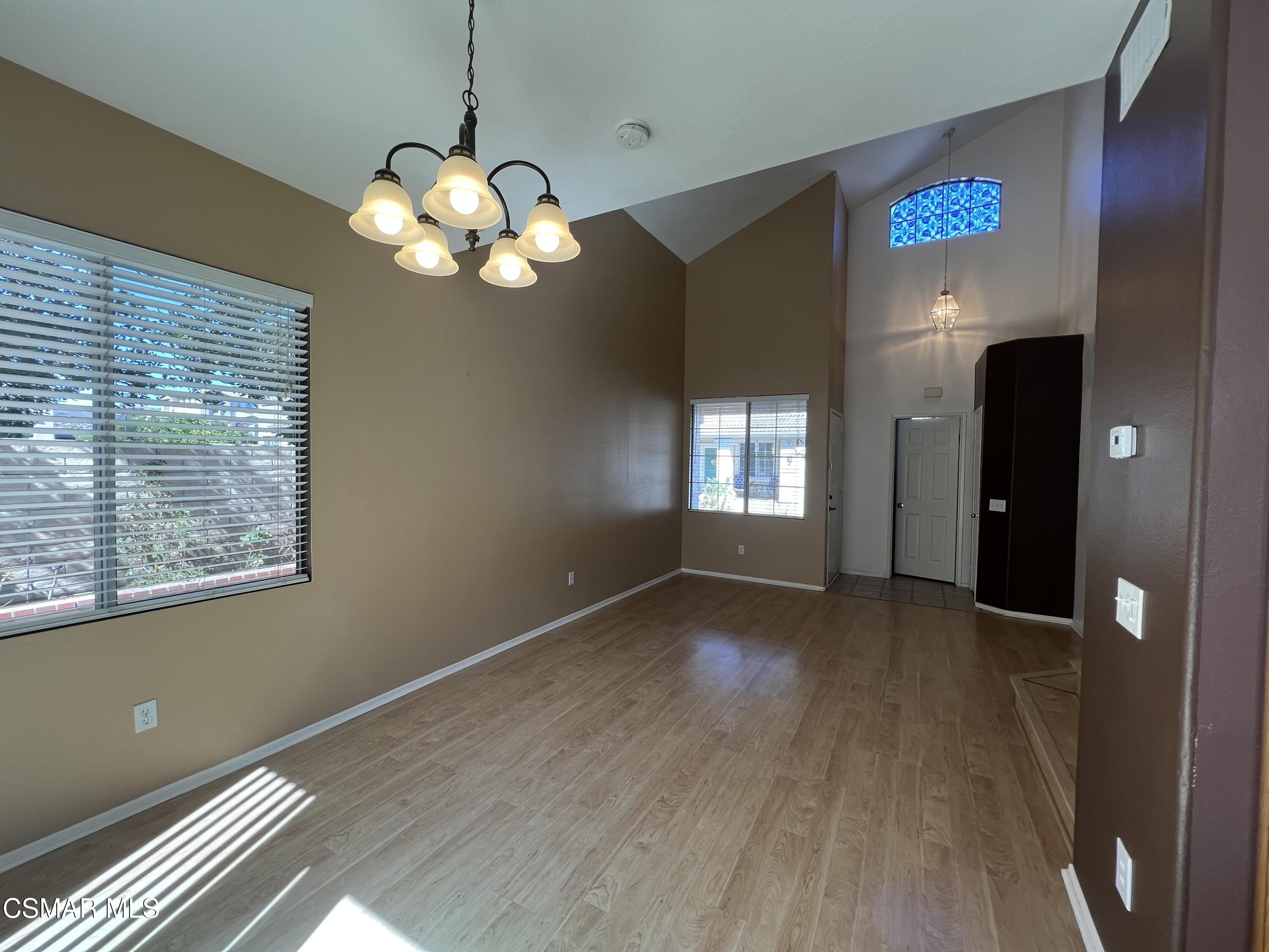 1961 Brookberry Lane Simi Valley, CA 93065 - Photo 7 of 23 a view of an empty room with window and wooden floor