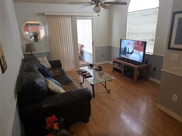 a living room with furniture and a window