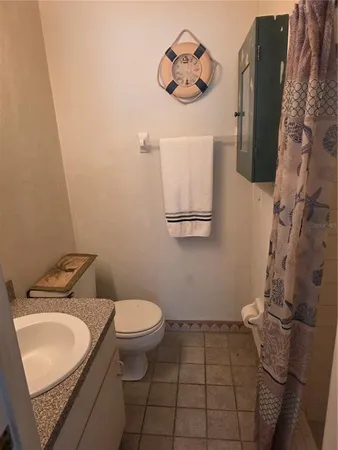 a bathroom with a sink toilet and vanity
