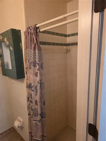 a bathroom with a shower and a tub