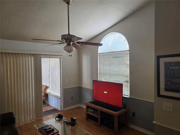 a room with furniture and a flat screen tv