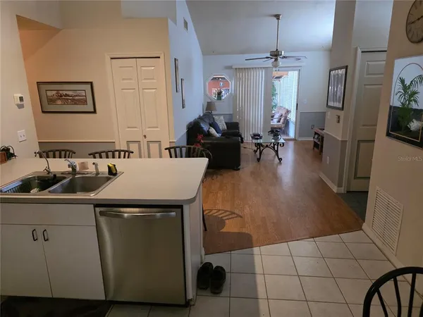 a kitchen with a sink appliances and cabinets