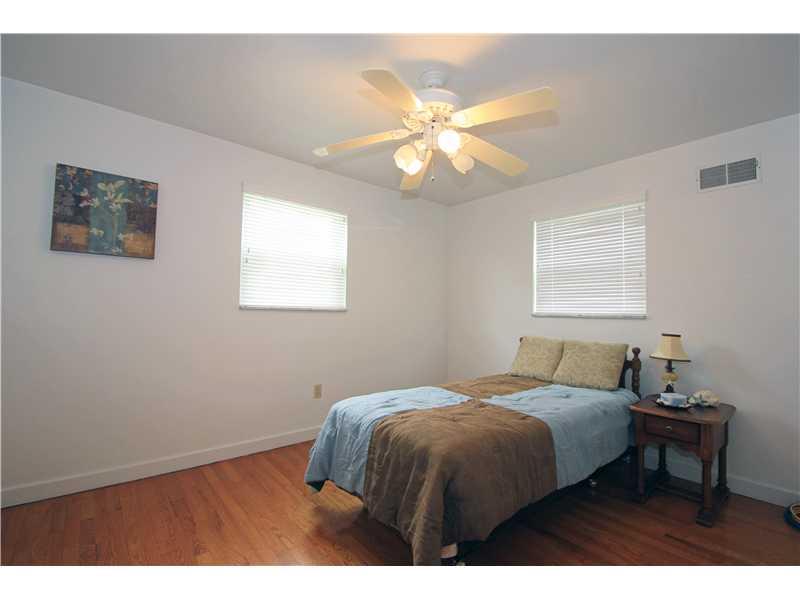 328 Rockhill Road Pittsburgh, PA 15243 - Photo 12 of 25 Bedroom. The secondary bedroom has two large windows as well and the oak hardwood floors are exposed in this room too! This room has neutral tone walls and a lighted paddle fan as well.