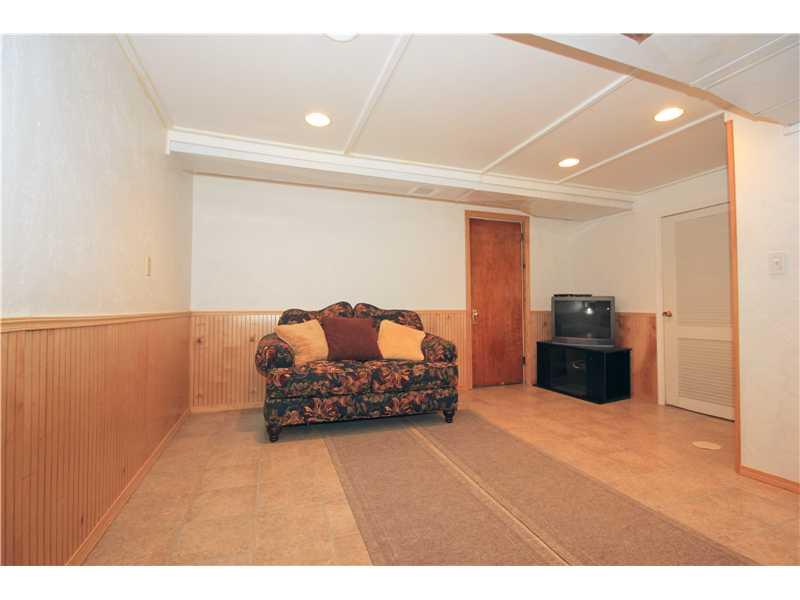 328 Rockhill Road Pittsburgh, PA 15243 - Photo 14 of 25 Family Room. The lower level family room area has a tile floor, half wood panel wall with chair rail and a nice finished ceiling with recessed lighting.