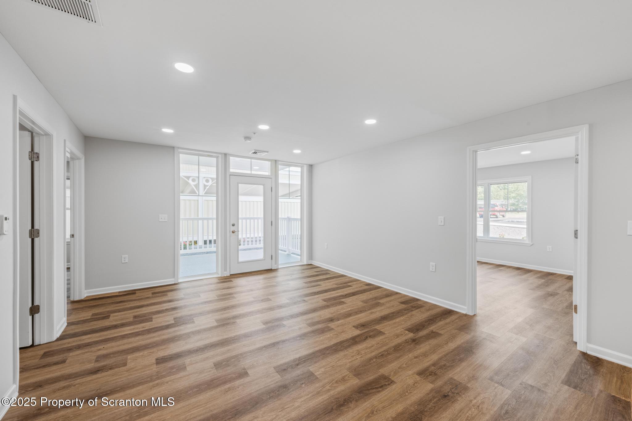 39 Zackery Way Old Forge, PA 18518 - Photo 4 of 6 a view of an empty room with wooden floor