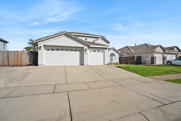a view of a house with a street