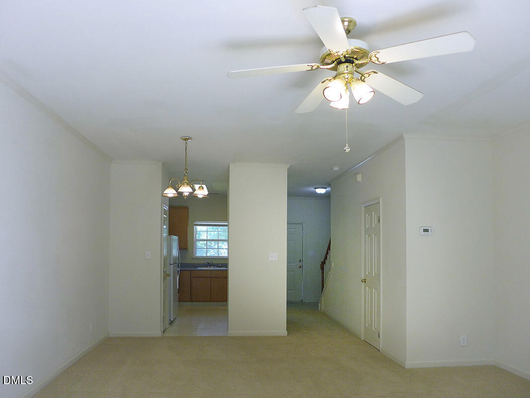 101 Rock Haven Road, Unit C301 Carrboro, NC 27510 - Photo 3 of 12 a view of an empty room and chandelier fan