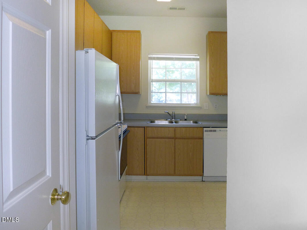101 Rock Haven Road, Unit C301 Carrboro, NC 27510 - Photo 6 of 12 a bathroom with a sink a mirror and a bathtub