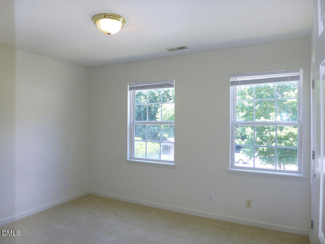 101 Rock Haven Road, Unit C301 Carrboro, NC 27510 - Photo 7 of 12 an empty room with a window