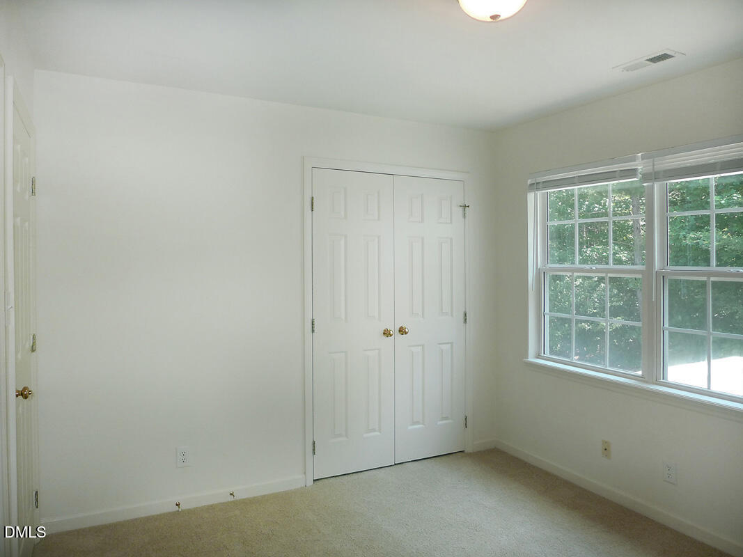 101 Rock Haven Road, Unit C301 Carrboro, NC 27510 - Photo 8 of 12 an empty room with a window
