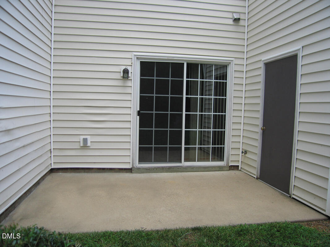 101 Rock Haven Road, Unit C301 Carrboro, NC 27510 - Photo 10 of 12 a view of a house with a large window and a yard