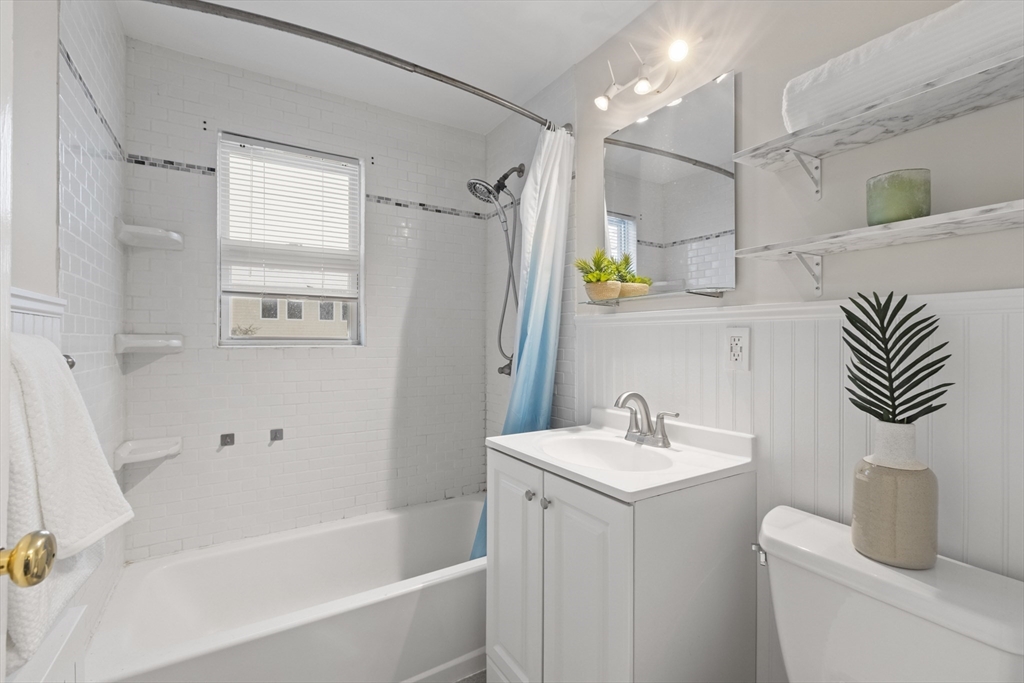 58 Neillian Way, Unit 58 Bedford, MA 01730 - Photo 13 of 23 a bathroom with a sink a toilet and shower