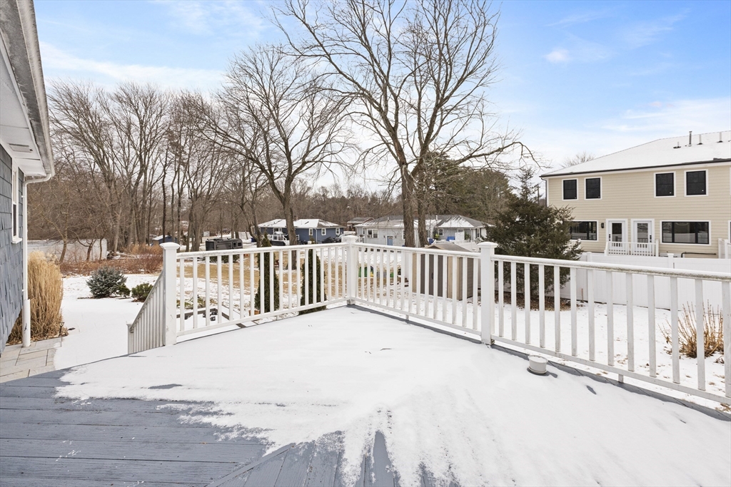 58 Neillian Way, Unit 58 Bedford, MA 01730 - Photo 16 of 23 a view of a street with a white house