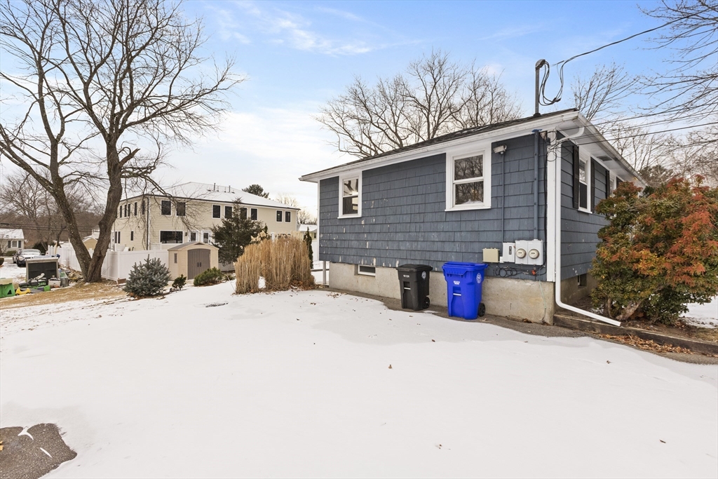 58 Neillian Way, Unit 58 Bedford, MA 01730 - Photo 19 of 23 a view of a house with snow on the road