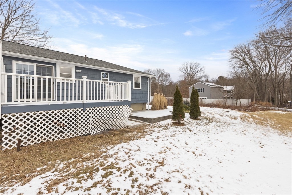 58 Neillian Way, Unit 58 Bedford, MA 01730 - Photo 22 of 23 a front view of a house with a yard