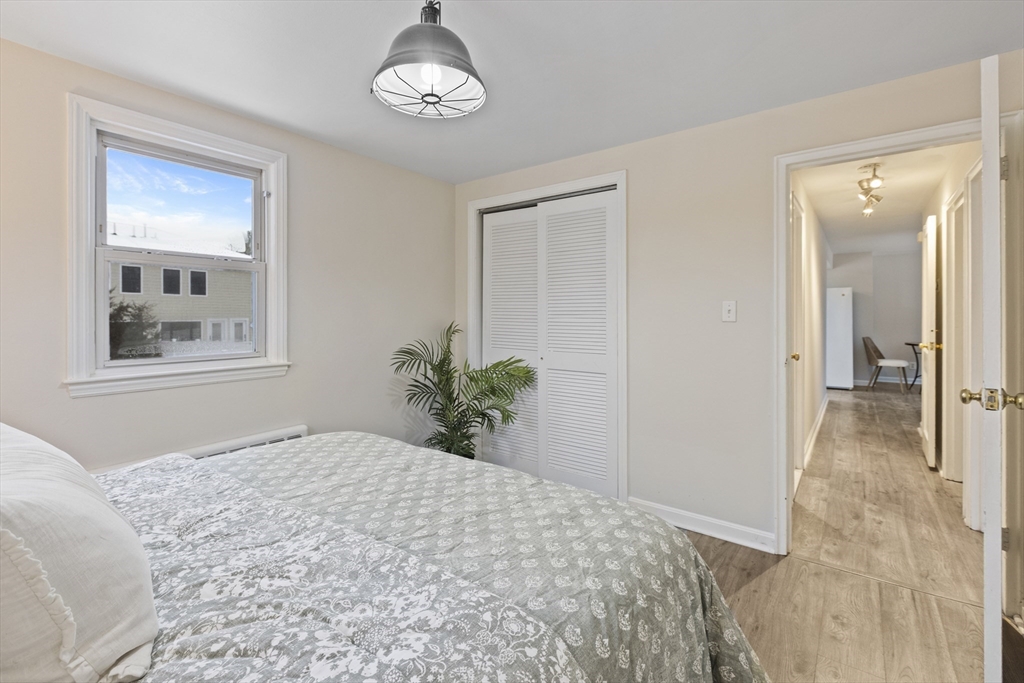 58 Neillian Way, Unit 58 Bedford, MA 01730 - Photo 8 of 23 a bedroom with a large bed and a window