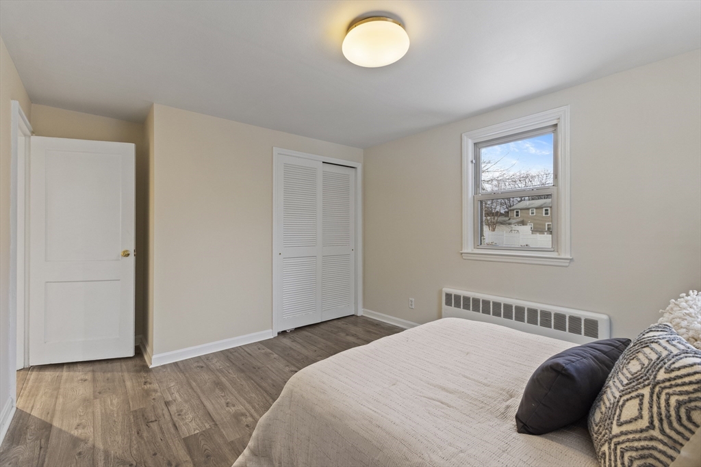 58 Neillian Way, Unit 58 Bedford, MA 01730 - Photo 10 of 23 a bedroom with a bed and a window