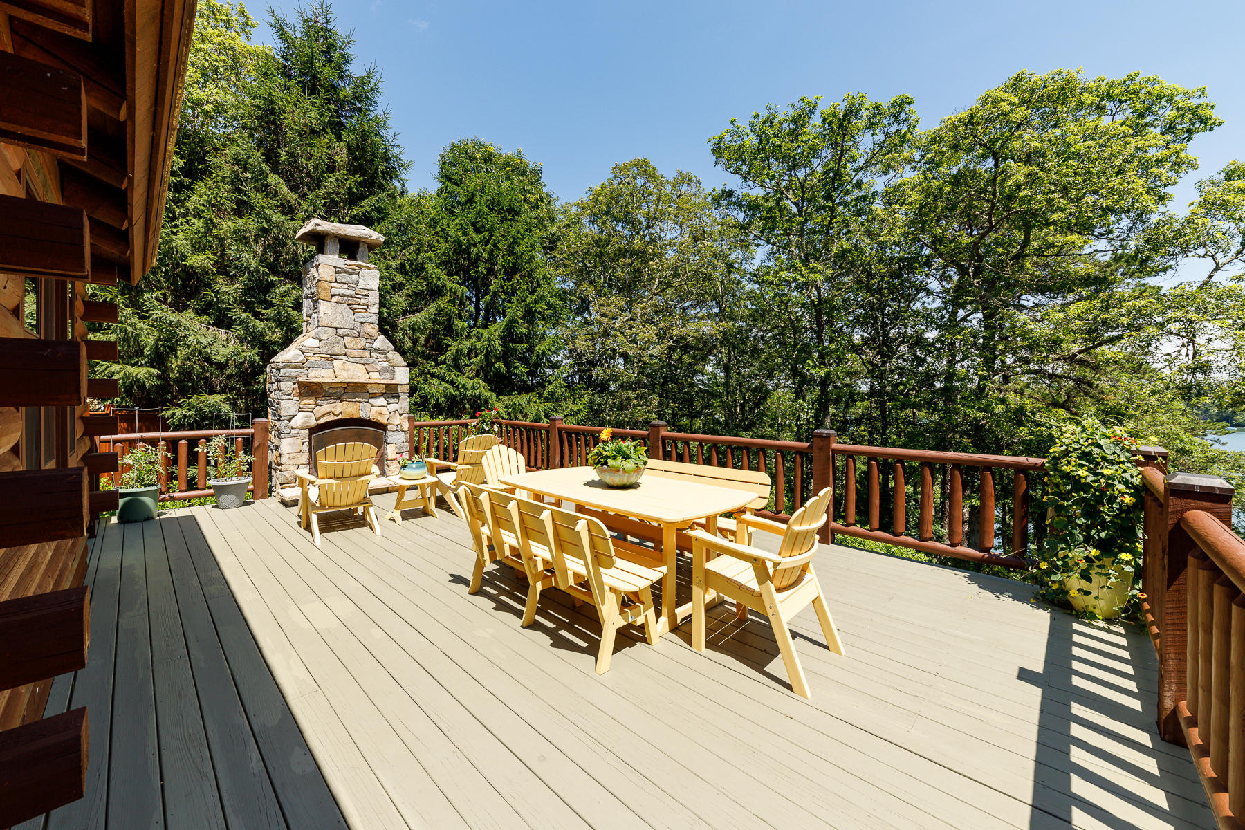 252 Valley Road Plymouth, MA 02360 - Photo 28 of 78 a view of a roof deck with table and chairs a barbeque with wooden floor and fence