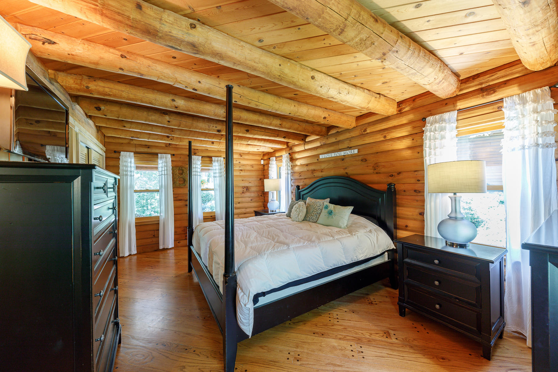 252 Valley Road Plymouth, MA 02360 - Photo 31 of 78 a bedroom with a bed and wooden floor