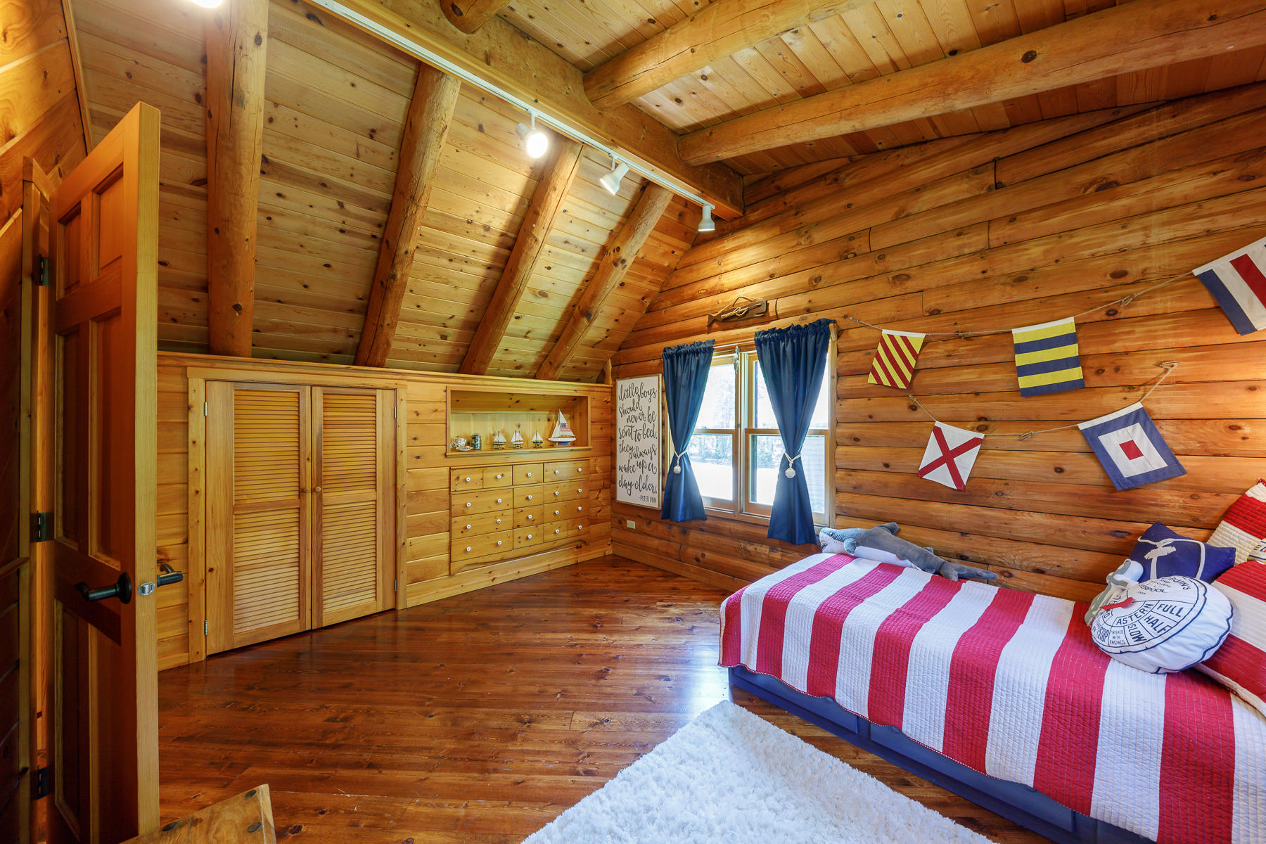 252 Valley Road Plymouth, MA 02360 - Photo 45 of 78 a spacious bedroom with a bed and wooden floor