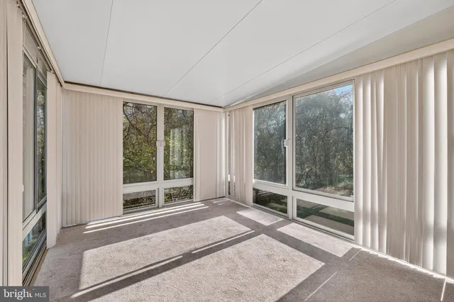 a view of a room with a large window