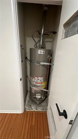 a view of a livingroom with wooden floor and stairs