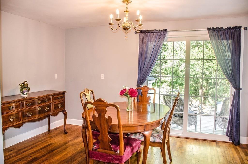 183 Lancaster Road Berlin, MA 01503 - Photo 11 of 41 a view of a dining room with furniture window and wooden floor