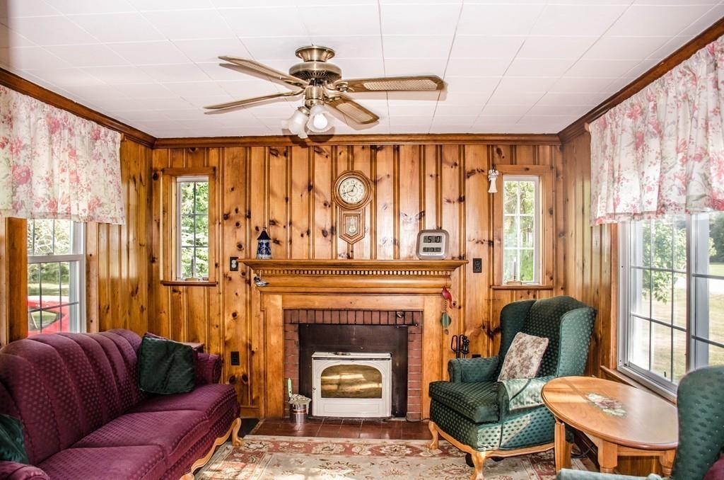 183 Lancaster Road Berlin, MA 01503 - Photo 12 of 41 a living room with furniture and a fireplace