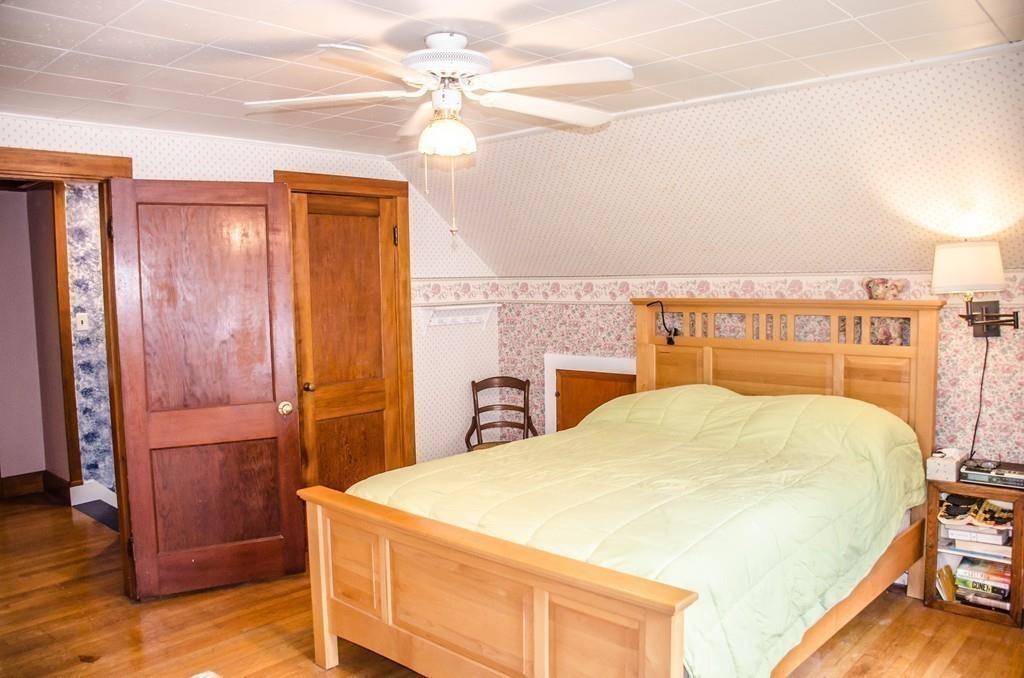 183 Lancaster Road Berlin, MA 01503 - Photo 27 of 41 a bedroom with a bed and a dresser