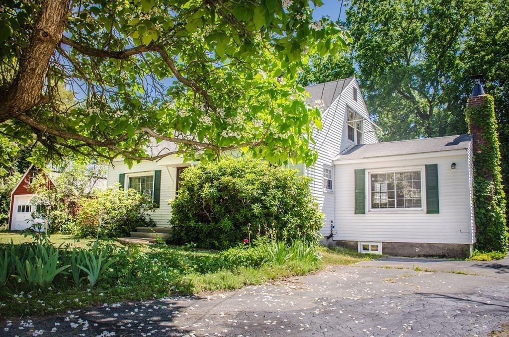 183 Lancaster Road Berlin, MA 01503 - Photo 3 of 41 a view of a house with brick walls and plants