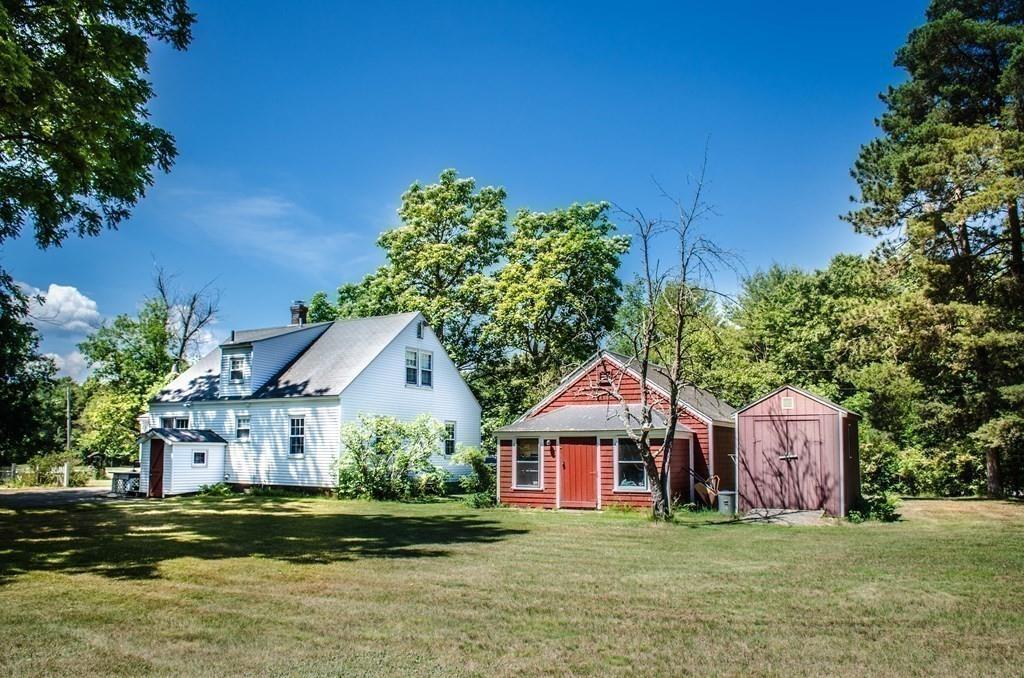 183 Lancaster Road Berlin, MA 01503 - Photo 36 of 41 a front view of a house with a garden