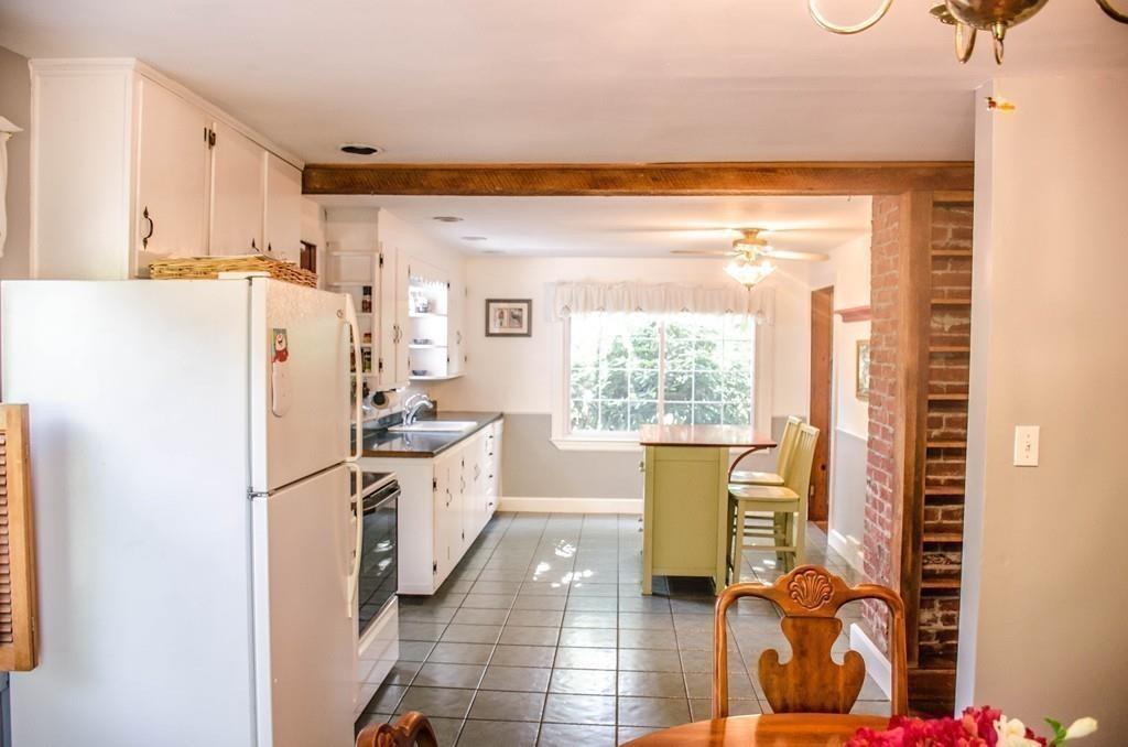 183 Lancaster Road Berlin, MA 01503 - Photo 10 of 41 a kitchen with stainless steel appliances a refrigerator and a stove