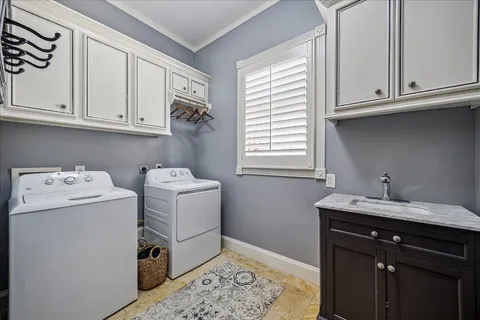 a utility room with closet dryer and washer