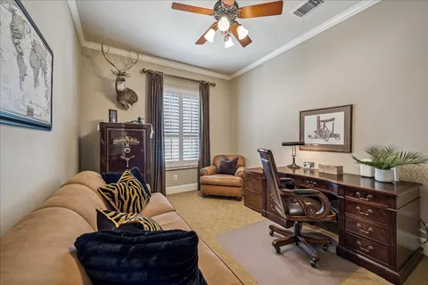 a view of a livingroom with workspace and a couch