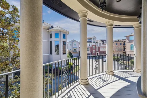 a view of a balcony with wooden floor