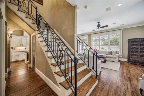 a view of entryway and hall with wooden floor