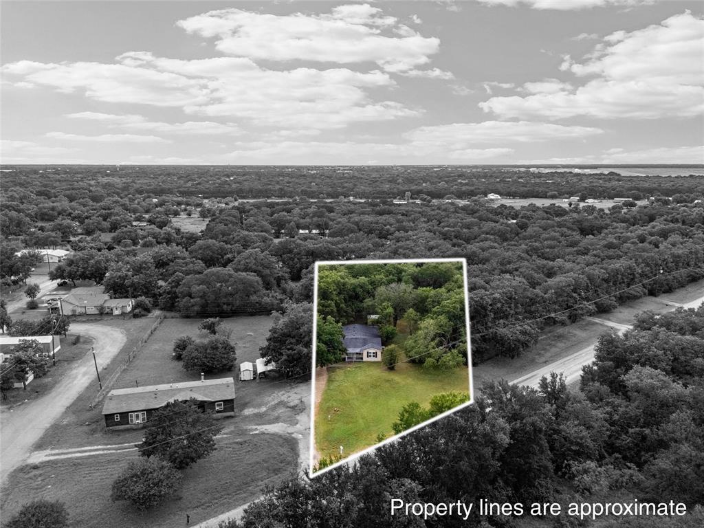 4704 Williams Road Bellmead, TX 76705 - Photo 2 of 32 Aerial perspective showcasing a single-story residence surrounded by mature trees
